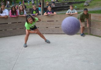 Campers playing gaga ball in a well built pit.