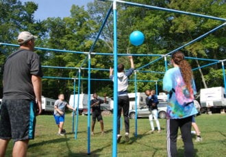 People playing 9 square in the North Lawn Play Area.