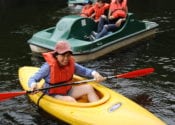 People in canoes and peddle boats.