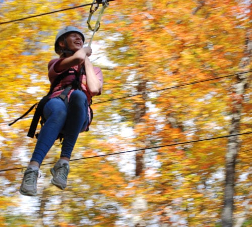 A person on a zip line.
