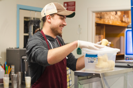 Worker helping in the kitchen - Earn $10 an hour while gaining valuable ministry experience